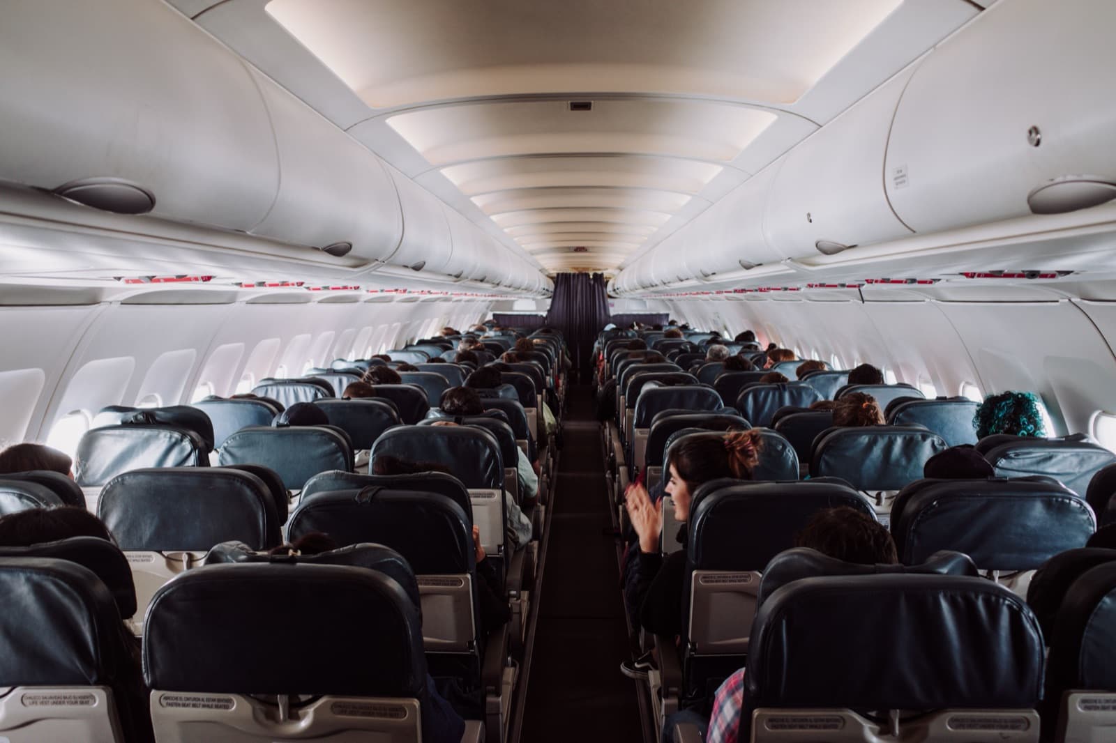 Rows of seats in an Urban Air cabin with the aisle running to the front